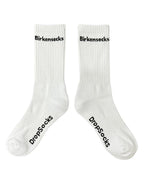 Two white socks with Birkensocks written black text on them